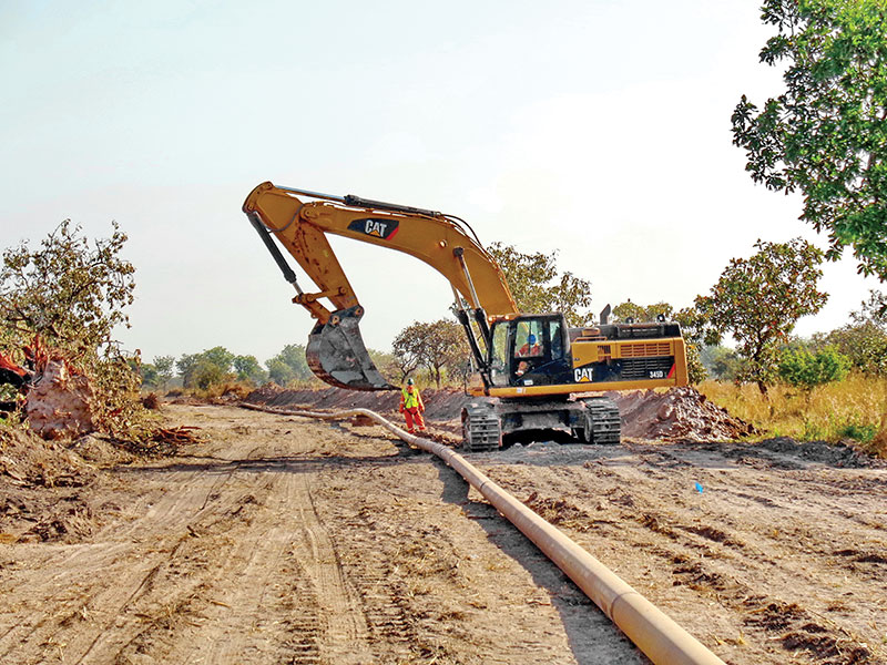 Excavation for an oil pipeline in a rural area in sub-Saharan Africa. 
