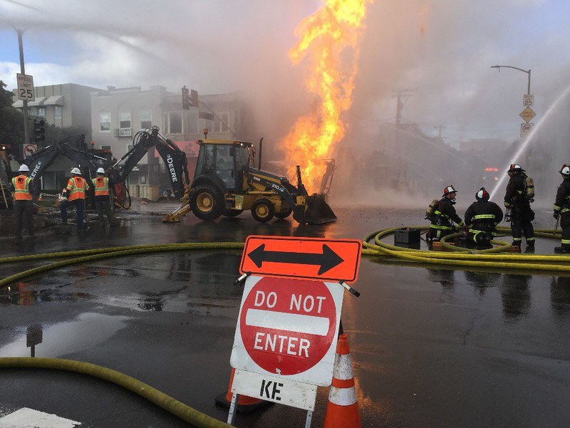 In this photo taken Feb. 6, 2019, firefighters and PG&E employees, respond to the natural gas-fueled fire that erupted after a pipeline branch connection was damaged during excavation. Photo courtesy of PG&E