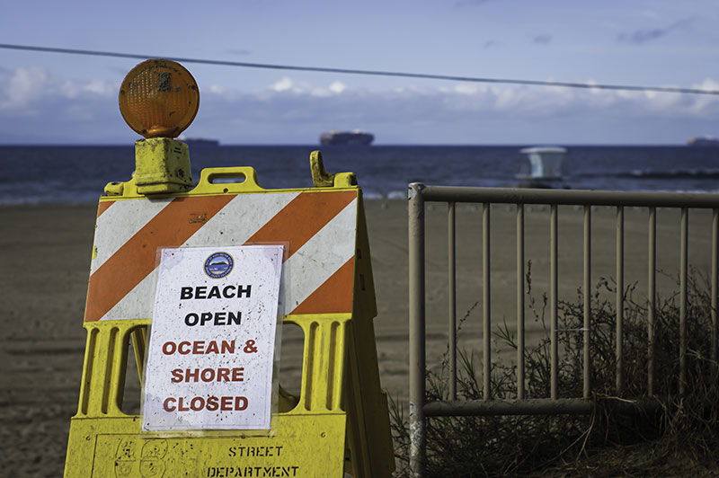 A warning sign at Huntington Beach in California.